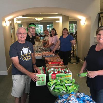 Sugar Land Baptist Church volunteers prepare food items for snack bags